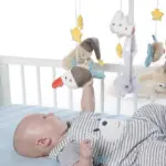 Muzikālais karuselis gultiņai Fehn Bruno ar mazuli