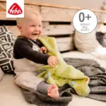 Sedziņa Fehn Dino yellow 100x75 cm ar priecīgu mazuli